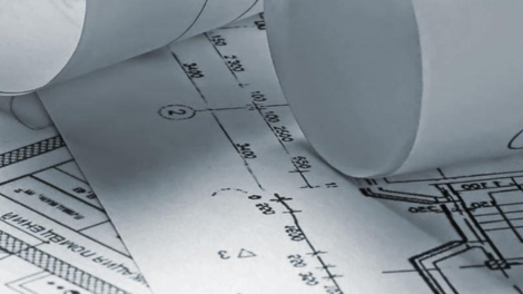 Close-up of architectural blueprints representing hands-on learning in StFX’s university science programs in Engineering
