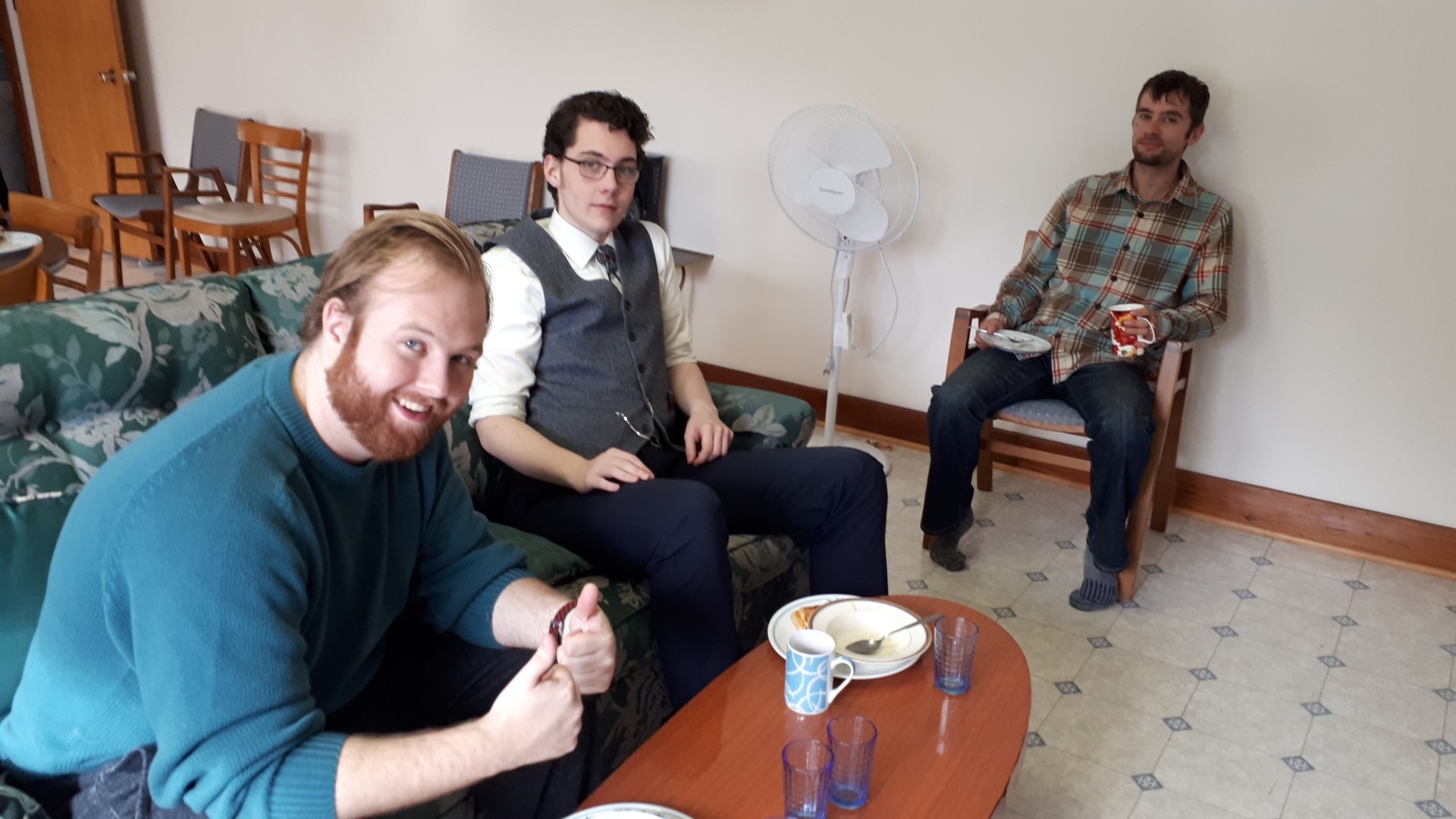 Three people sitting casually