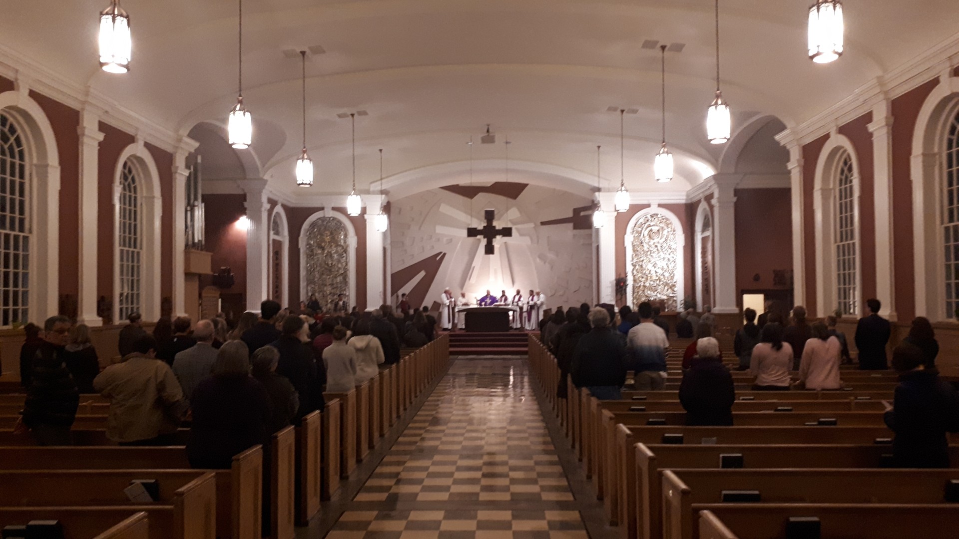 The inside of a church with people in the pews