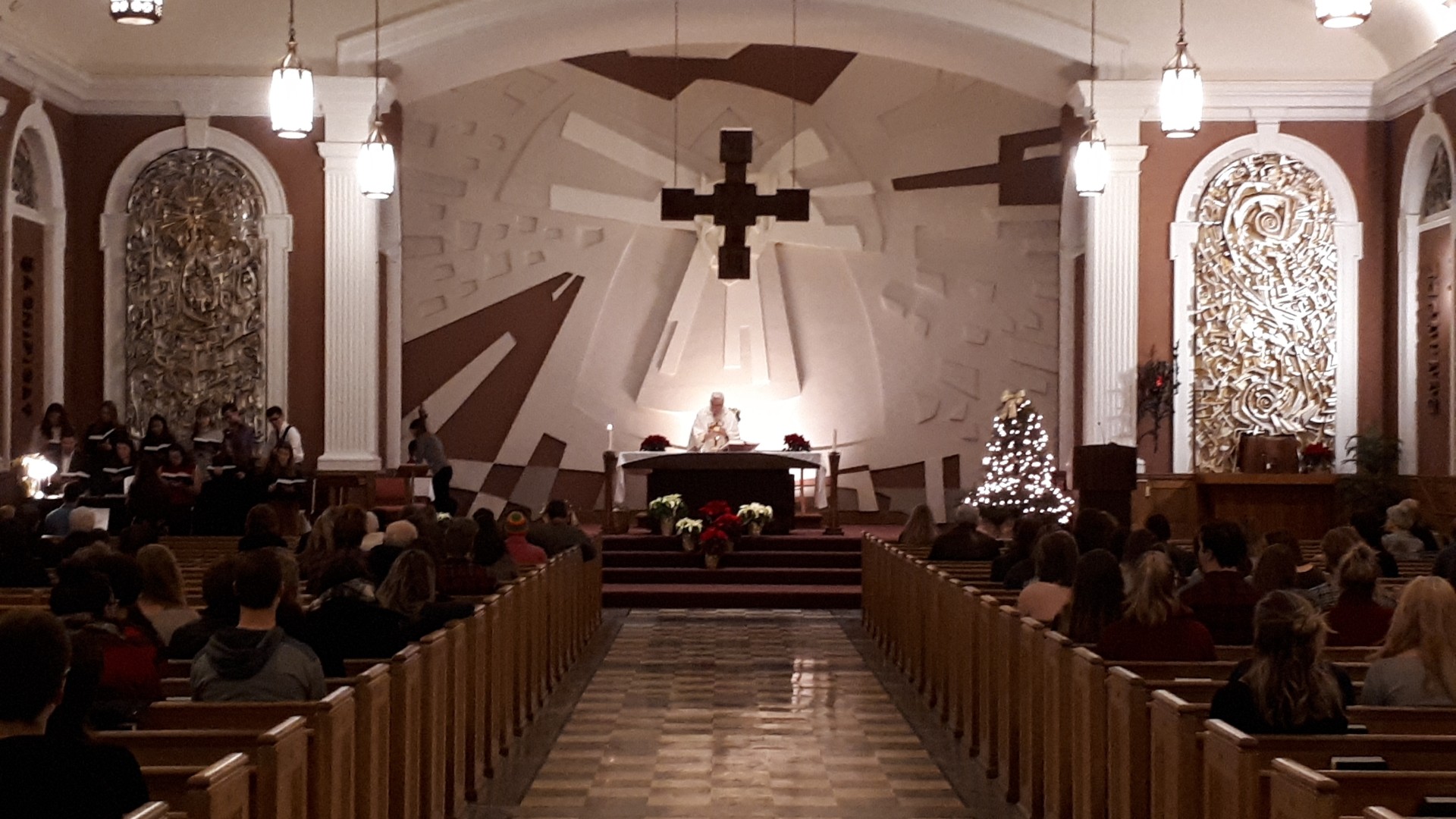 The inside of a church with people in the pews