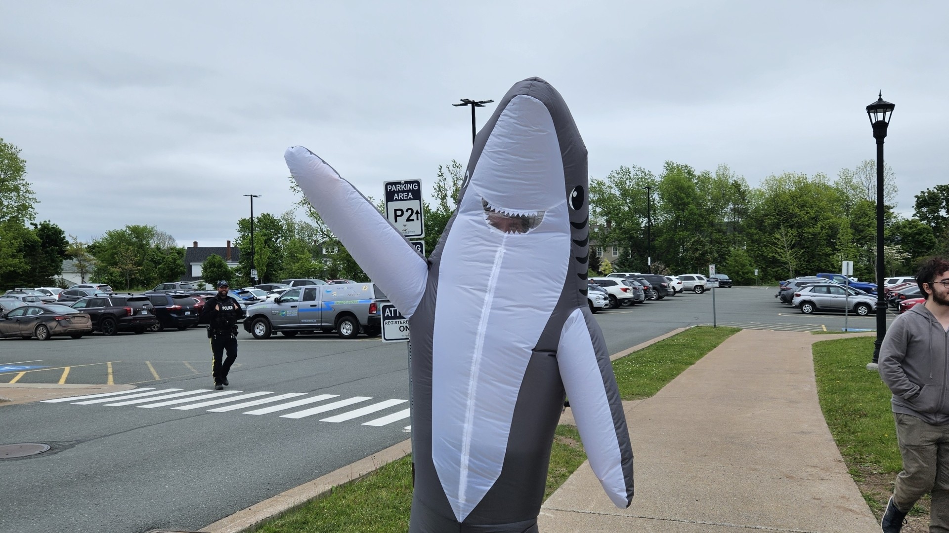 A shark mascot at World Oceans Day 2024