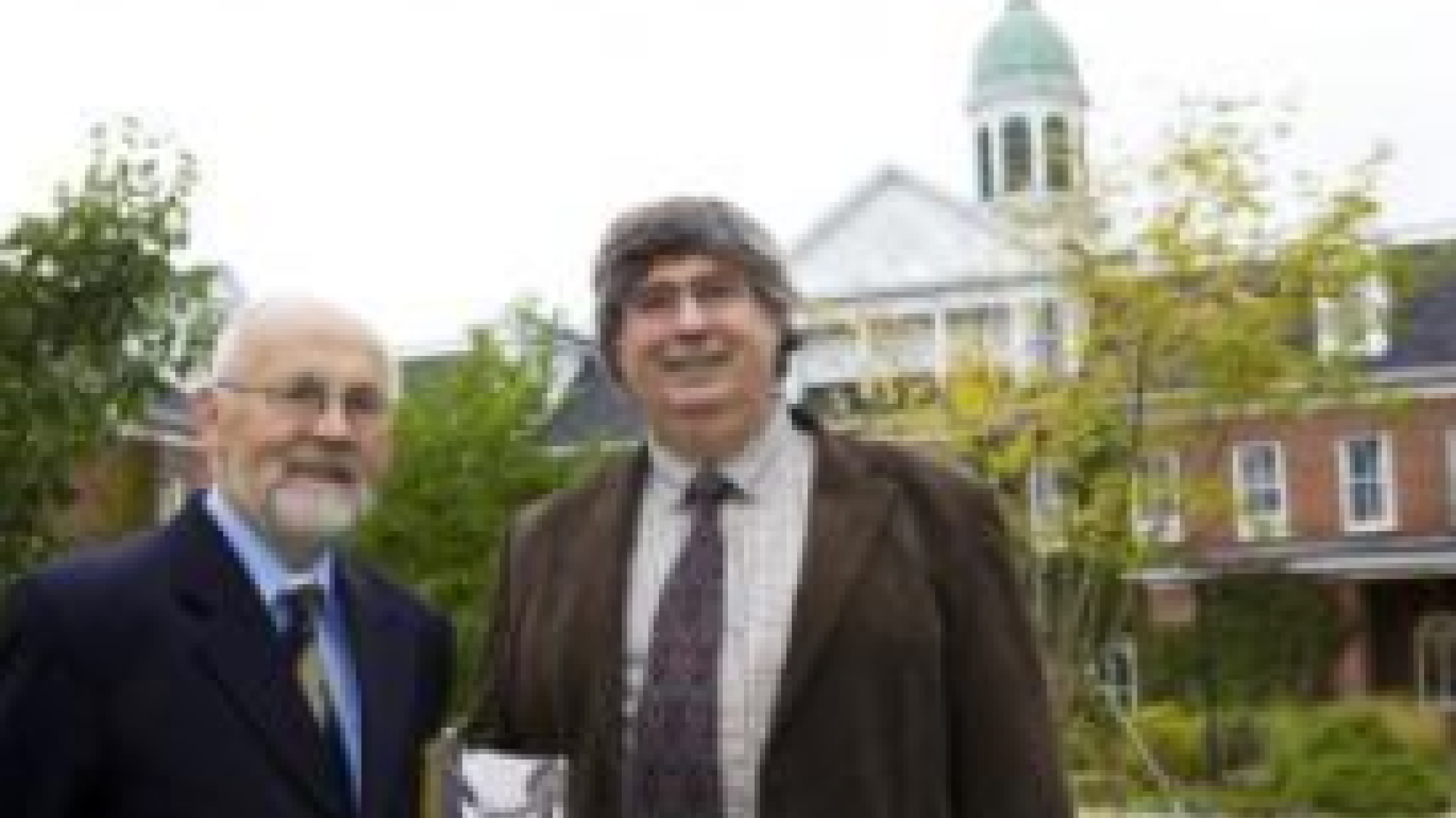 Two people standing together outdoors