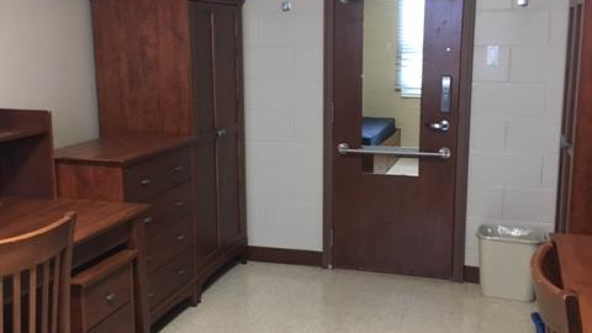 Inside a double room with two desks and dressers 