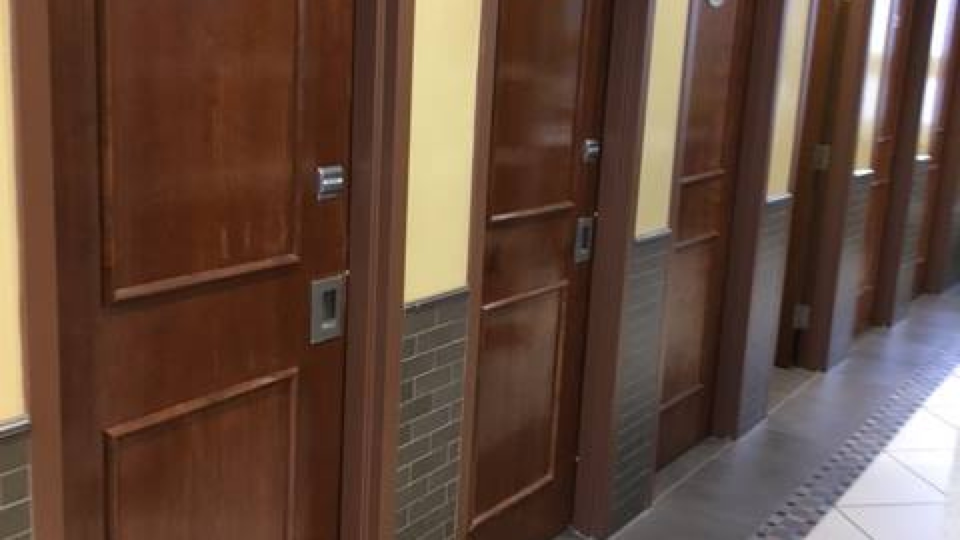 Hallway with dorm rooms along each side 