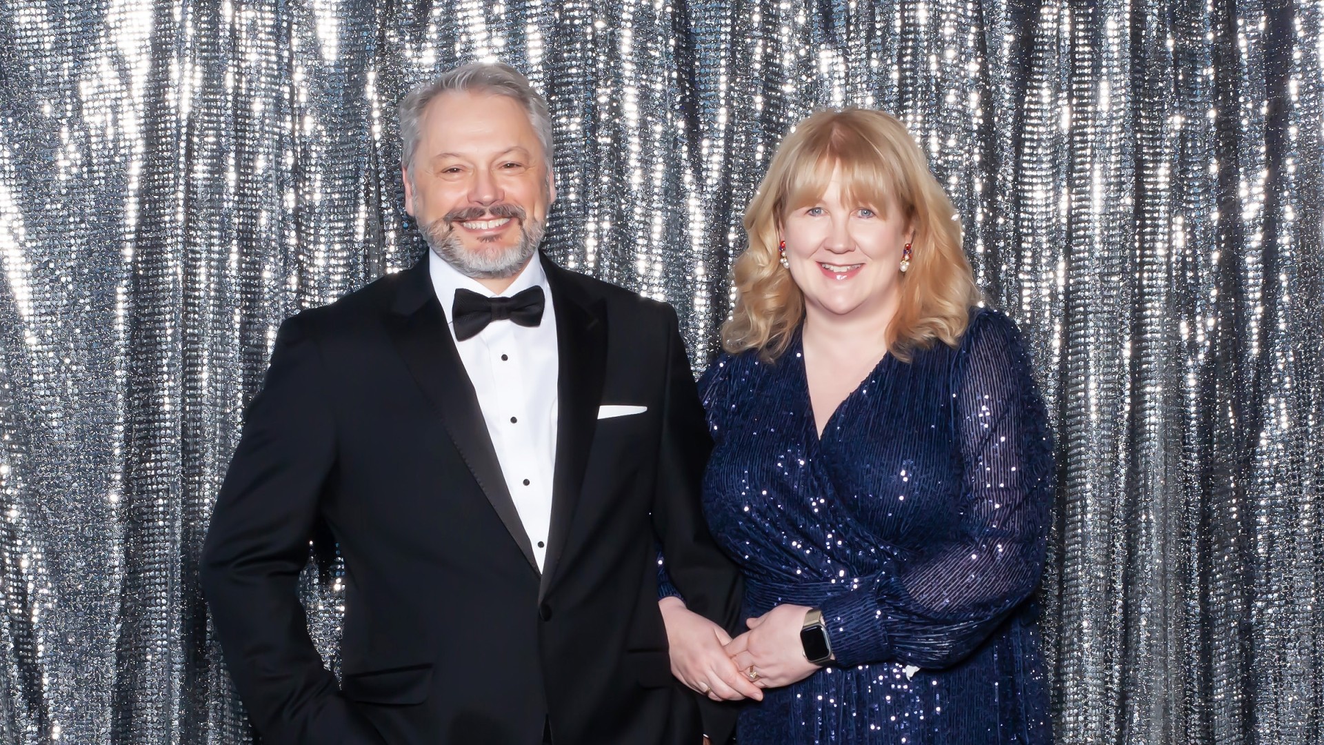 People in formal wear at a gala event