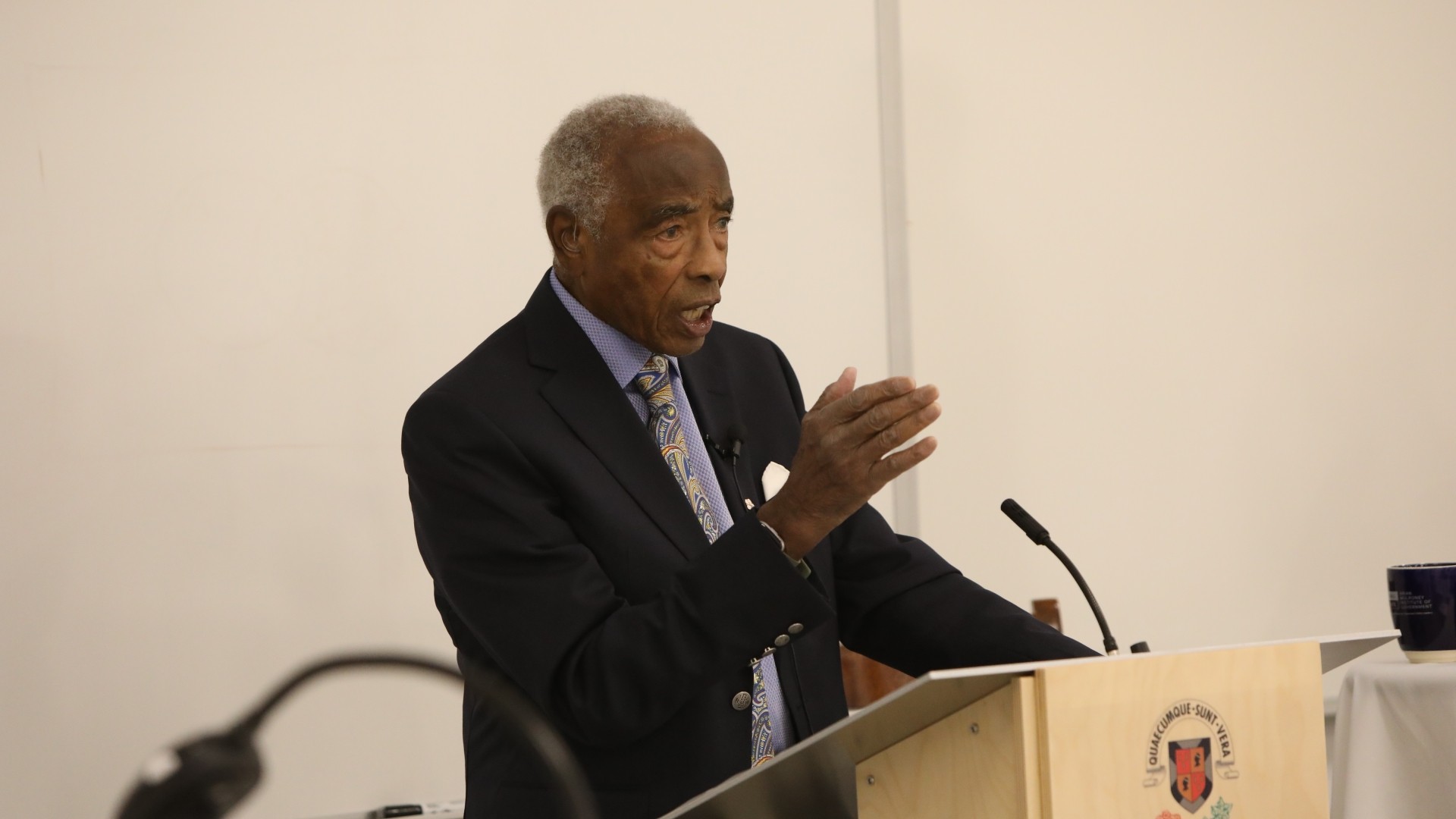 A man standing at a podium giving a lecture