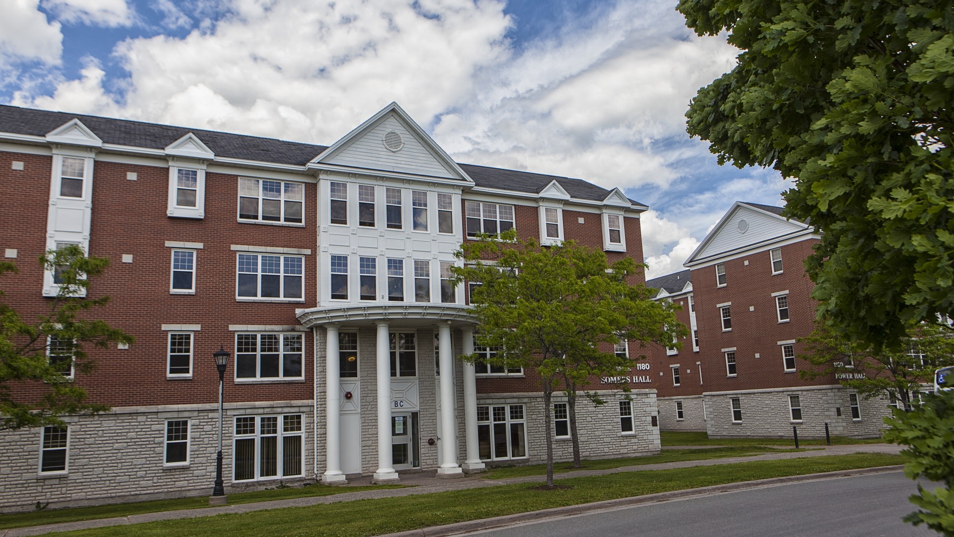Exterior view of Somers Hall on a cloudy day.