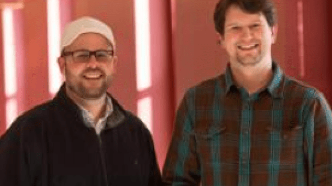 Two people standing together 