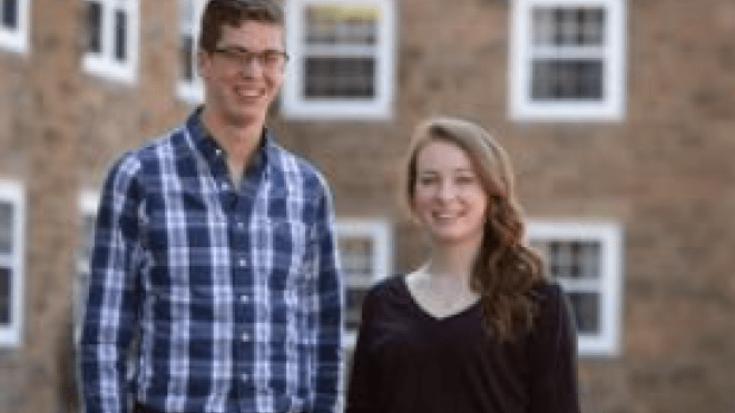 Two people standing together 