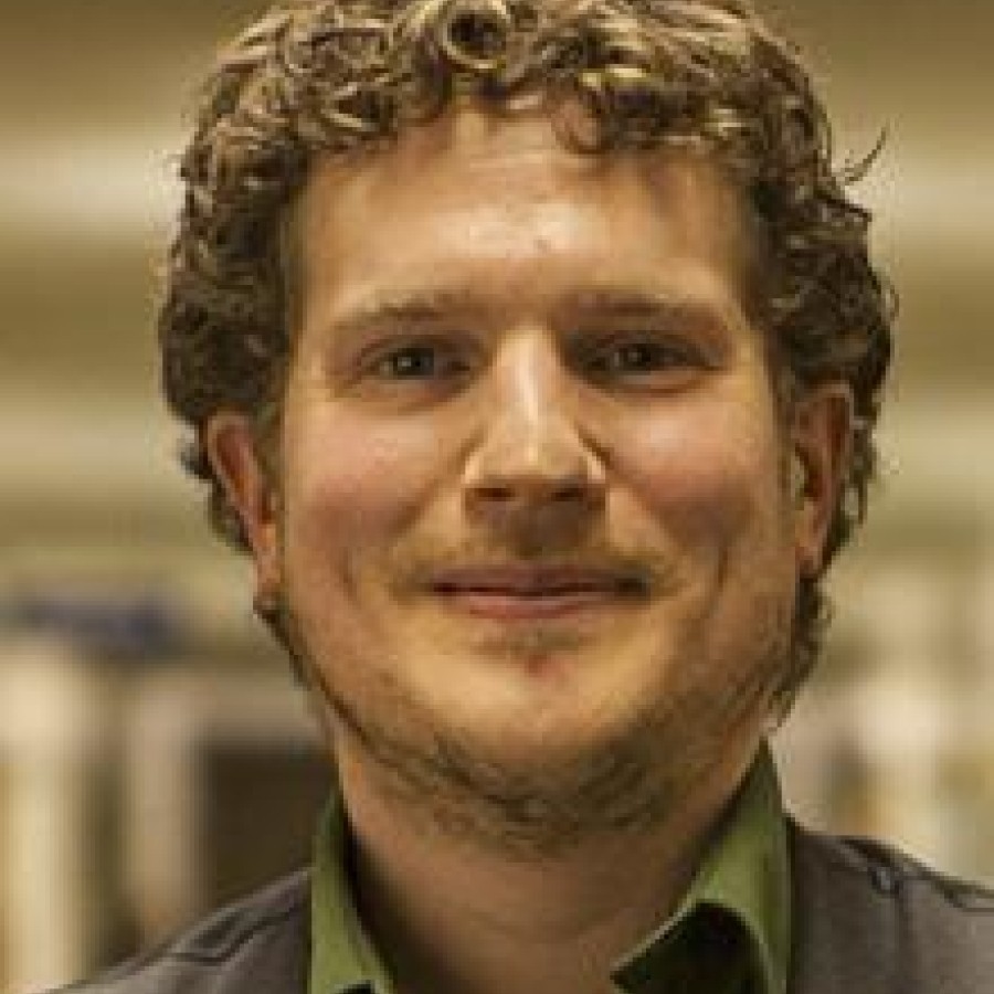 A close up of a person wearing a vest