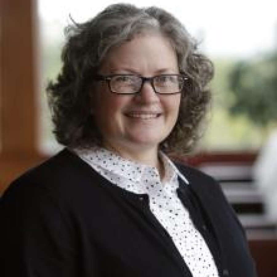 Headshot of Jane MacDonald smiling.