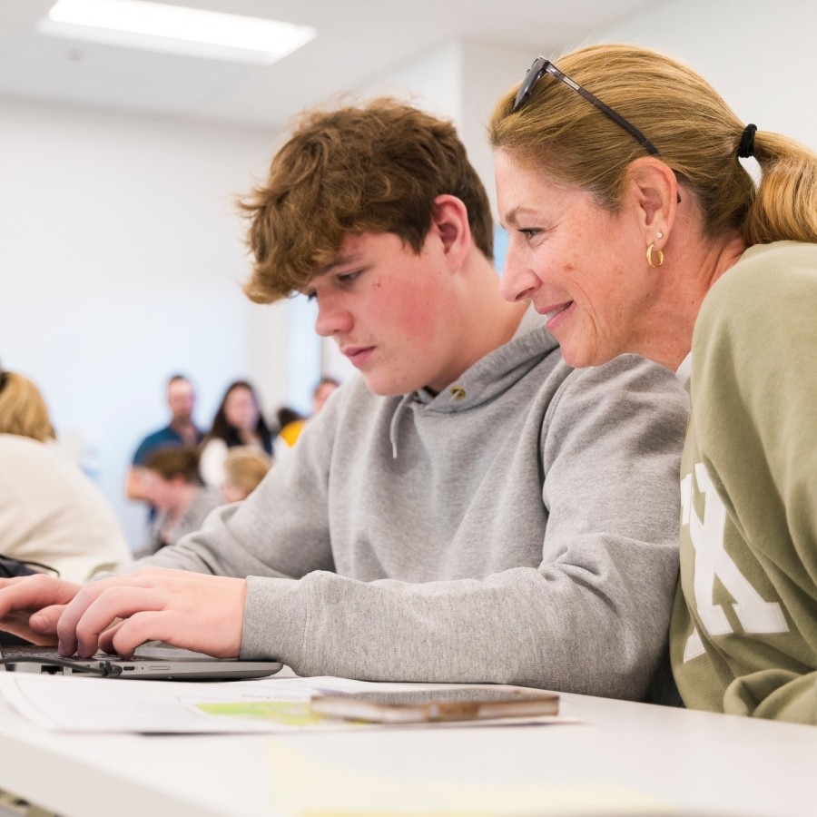 Student and their parent at the application station during the StFX Open House