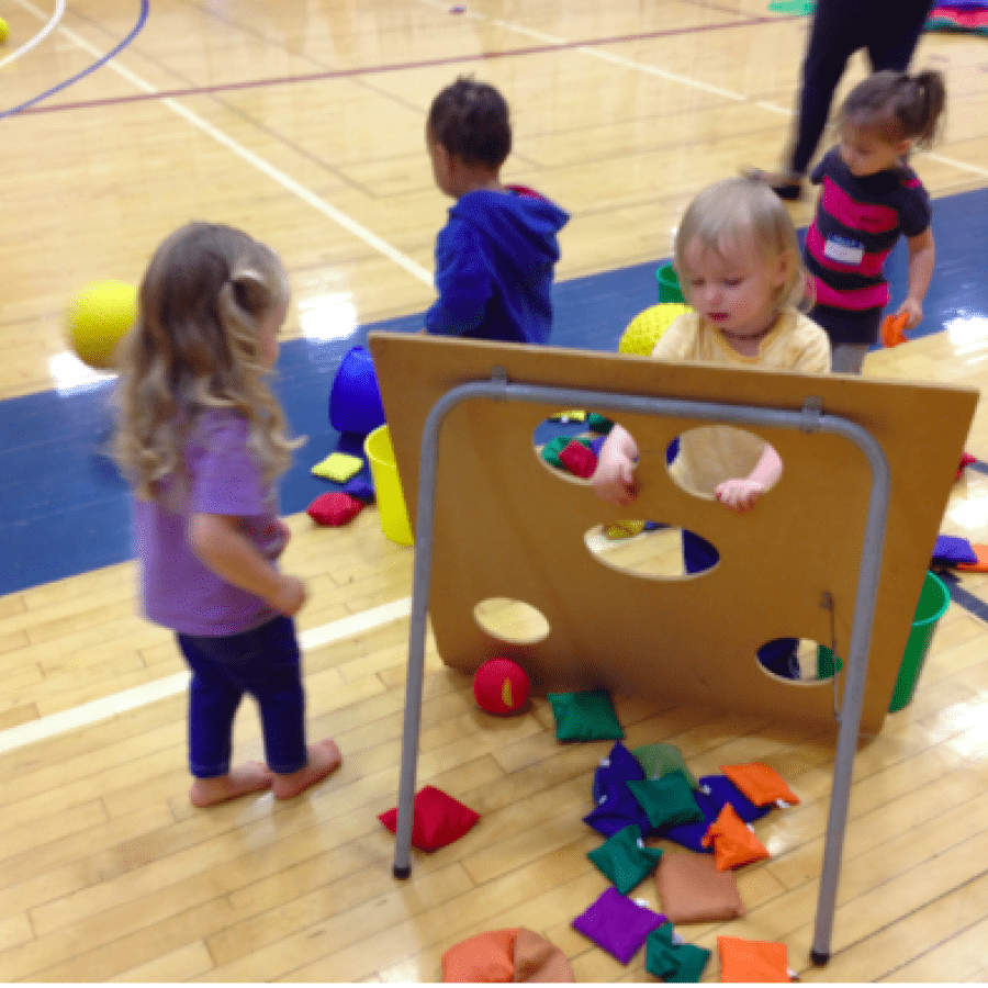 Young children play a game on campus