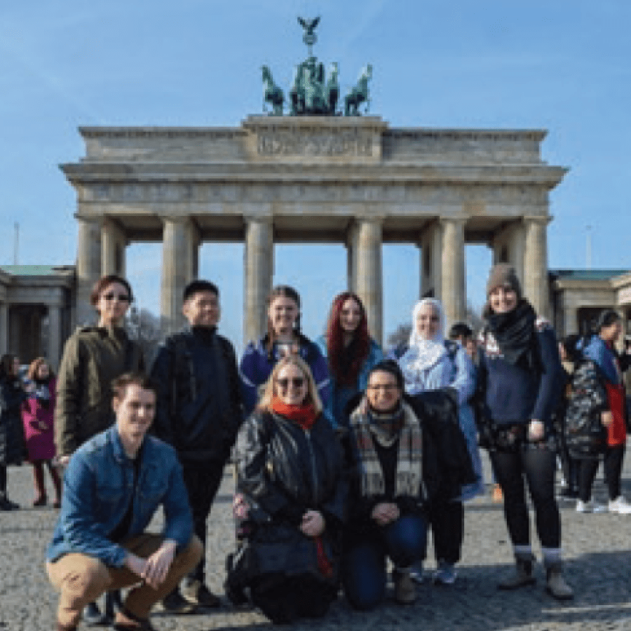 A group of people in front of a pavillion