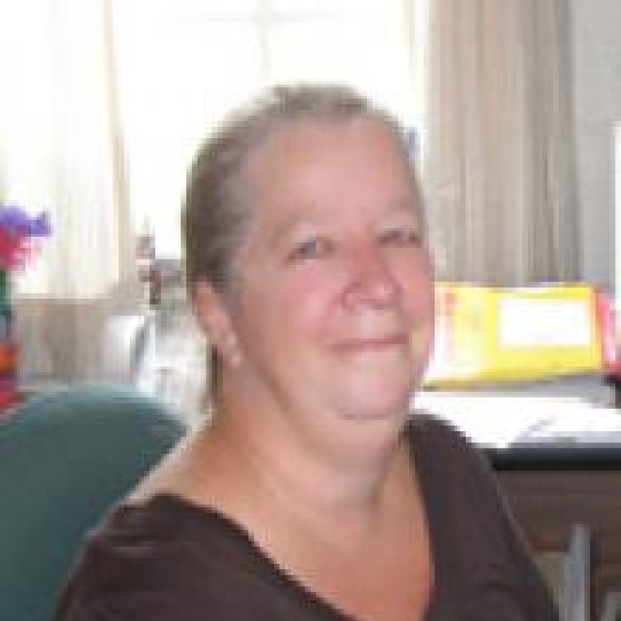 Headshot of woman smiling.
