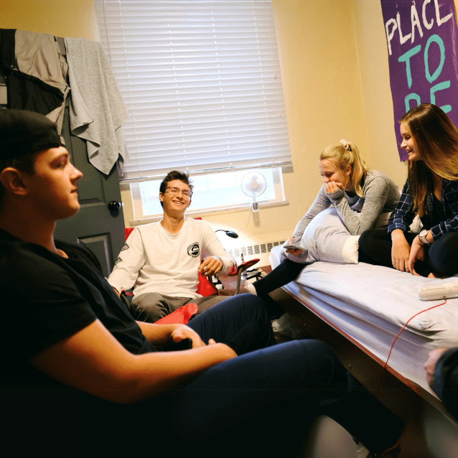 Students interacting in residence room