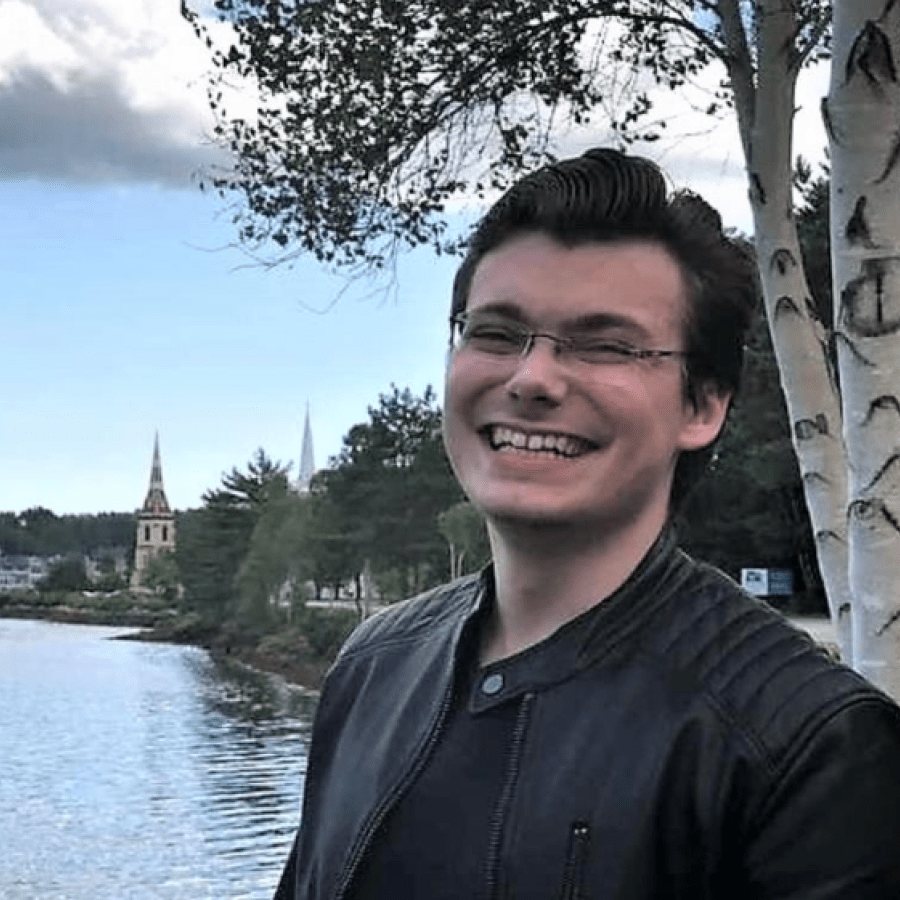Headshot of student standing outside