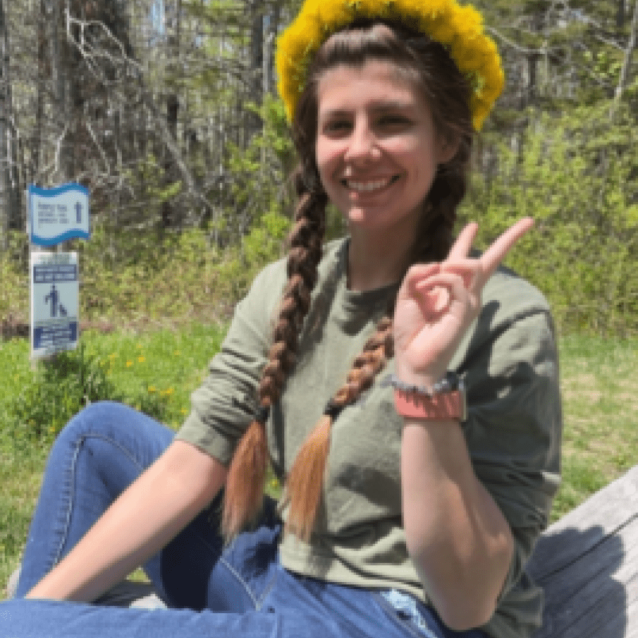 Woman sitting outside on a bench