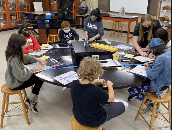 Picture of 2 Students Showing their Mockup Model of the Ocean's Floor