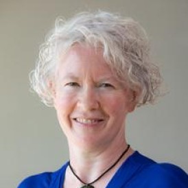 Headshot of woman smiling.