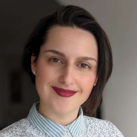 Headshot of woman smiling.